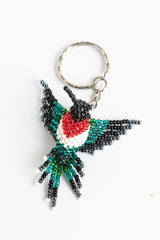 Fringe-tailed hummingbird; small; green,black,white,red