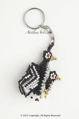 Penguin with chick black silver white stripe wings [Birds]